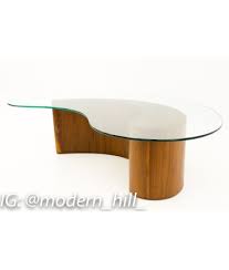 Whether you're looking for a sleek modern glass coffee table or a solid hardwood end table with storage, bdi table collections are sure to please. Vladimir Kagan Mid Century Modern Comma Coffee Table