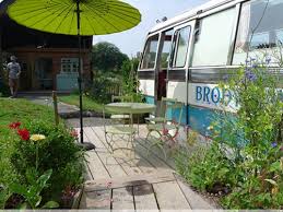 this old bus is actually a cozy charming hotel bus house cozy cottage tiny house towns pinterest
