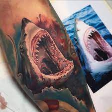 You can decide if you want to do it as a shark head tattoo or as a large great white tattoo. Jaws Tattoo Done By Benjamin Laukis Shark Tattoos Mouth Tattoo Great White Shark