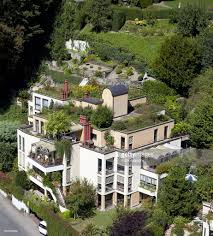 Eco roofs, or turf or green roofs as they're sometimes called, are ones which have surrounding impervious rooftops are the major source of water runoff contributing to the small flood events. Architectural Image Of Eco Friendly Building With Roof Garden Roof Garden Rooftop Patio Rooftop Garden