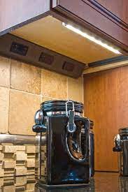 Linkable indoor warm white led tape lights, power supply, mounting hardware and connector wires. Angled Outlet Strip With Undercabinet Lighting Kitchen Outlets Cottage Kitchen Cabinets Under Cabinet Lighting