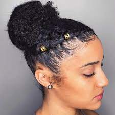 • now, twist the hair on both sides, one at a time to go over the middle bun. 60 Easy And Showy Protective Hairstyles For Natural Hair