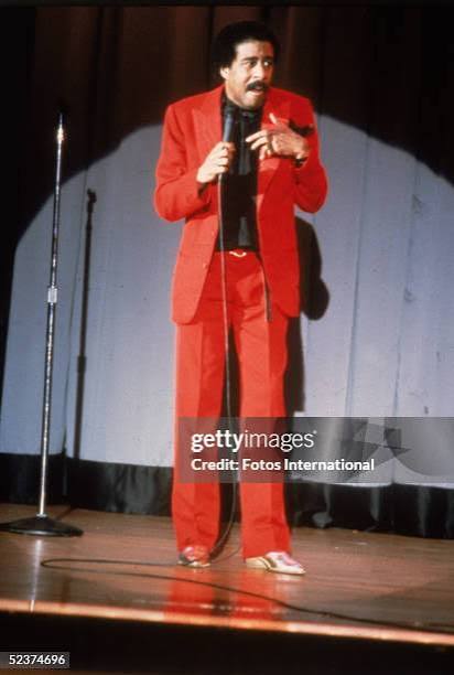 American comedian Richard Pryor wears a bright red suit as he... News Photo  - Getty Images