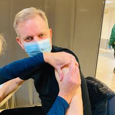Jeremy Kyle, 55, rolls up his sleeve to get the Covid vaccine in rare  social media appearance