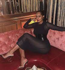 Who made Tracee Ellis Ross' black net dress and mule sandals? – OutfitID