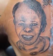 Unusual Baby Tattoo with Comb of Teeth