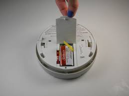 The battery compartment will be in the back of the unit and it requires a 9v battery. Smoke Detector Battery Replacement Ifixit Repair Guide