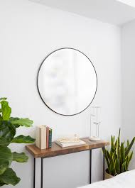 This stylish gold decorative wall mirror offers a round design with subtle carved detail to the frame. Umbra Hubba Wall Mirror Shop Modern Round Mirrors