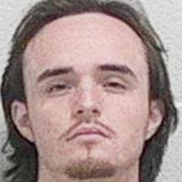 Two charged in armed robberies