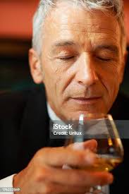 Wealthy Man Drinking Brandy Stock Photo
