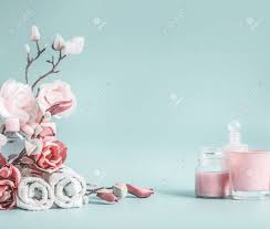 Beautiful flowers beneath a blue sky with fluffy cloud on a sunny day. Beauty Background With Pastel Pink Flowers And Cosmetic At Pastel Stock Photo Picture And Royalty Free Image Image 141037842