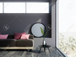 Living room, bedroom, dining room, patio and garden, kitchen Brown Living Room Corner With A Wooden Floor A Loft Window And A Long Comfortable Dark