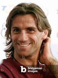 Image of Portuguese striker Joao Pinto smiles during a press conference at