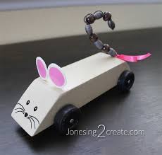 Before cutting, note that the axle notches aren't equidistant from the ends of the block; Mouse Pinewood Derby Car Jonesing2create