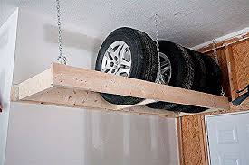 Noch Mehr Platz In Der Garage Sparen Mit Diesem Hangenden Regal Sind Die Nicht Genutzten Reifen Gut Verstaut Ideal In 2020 Garage Decor Mud Room Storage Diy Storage