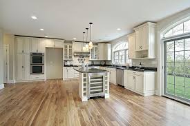 Having read your blog that blue gray is going to be out and trying to make the best choice we could, i went with what appealed to me and what seemed a bit warmer (oh no…taupey) gray. Open Plan Kitchen With Antique Cabinets Wood Floors And French Doors Tdf Blog