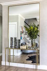 Guaranteed low prices on modern lighting, fans, furniture and decor + free shipping on entryway & foyer mirrors. Mirror Detail From Foyer By A List Interiors Hall Decor Entrance Hall Decor Living Room Mirrors