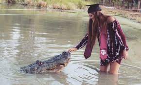 Additionally, several extinct species of alligator are known from fossil remains. Graduation Snap Texas Student S Photo With Alligator Goes Viral Animals The Guardian