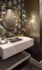 Chic wallpaper creates a unique background for a floating vanity in this room by kelly hohla interiors. Floating Marble Vanity This Powder Room Feels Chic Tailored And Impressive The Floating Vanity Is Cus Luxury Powder Room Powder Room Small Modern Powder Rooms