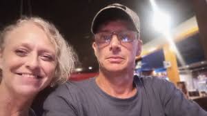 partner taking advice in cornhole