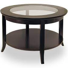 It also features a bottom shelf that can be used to keep newspapers, magazines, and other daily use items. Winsome Genoa Round Wood Coffee Table With Glass Top In Dark Espresso 92219