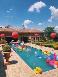Instead of featuring a ferocious shark, this party features a grinning shark throughout the party decorations. Pool Party Pool Birthday Party Kids Pool Party Decorations Pool Birthday