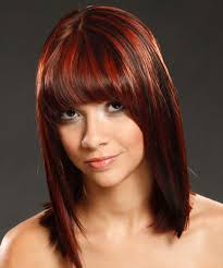 In this medium hairstyle, she tries shades of red and freshly dyed orange. Medium Hairstyles And Haircuts For Women