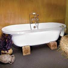 This gallery features beautiful bathrooms with clawfoot tubs. Great Idea Holding The Tub Up With Oak Blocks Cheap And Easy Bathtub Surround Tub Surround Tub Surround Ideas Cheap