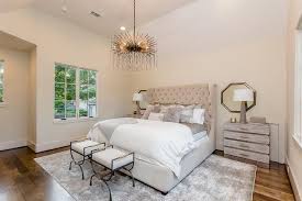 Restful Bedroom Boasts A Light Beige Velvet Tufted Wingback Bed Dressed In White And Gray Bedding Acce Beige Walls Bedroom Restful Bedrooms Beige Bedroom Decor