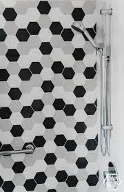 This bathroom boasts a beautiful black tile on a single wall, which can feel dark in an enclosed we've seen white tiles with black grout incorporated a lot. Modern Black And White Bathroom Lemon Thistle