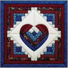 Many free log cabin quilt patterns follow the traditional method of putting them together, but if you'd like to try your hand at piecing the entire quilt block pattern together as you work, try the quilt as you go log cabin block. Quilt Magic 15 1 2 X 15 1 2 Inch Log Cabin Heart Kit Amazon Co Uk Home Kitchen