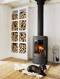 The best wood burning stove will make your home warm and entertain your guests. 7 Indoor Firewood Storage Solutions Wood Stove Decor Wood Stove Fireplace Stove Decor