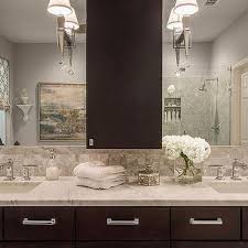 In the adjacent living room, we painted the existing cabinets espresso to match the kitchen and went in with a larger scale version of the backsplash stone tile on the fireplace to the ceiling. Espresso Bathroom Cabinets Design Ideas