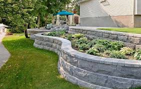 Many of us dream of a backyard pond with waterfalls. Techo Bloc Walls Monumental Wall Cap At Lincoln Way Landscape Supply Backyard Landscaping Modern Garden Patio Stones