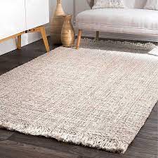 This handmade 100% jute rug has a hearty texture that adds visual warmth to your home while being comfortable underfoot. Cream Hand Woven Chunky Loop Jute Area Rug 7x9 Kirklands