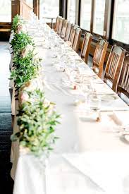 Head Table Garland Of Italian Ruscus With Garden Rose Bouquets At The Lake House Calgary Ph Head Table Wedding Flowers Italian Ruscus Table Floral Decorations
