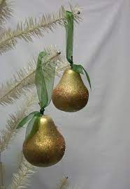 These beautiful pear christmas ornaments are a custom design by me, each pear is hand cut, carefully assembled, and fired to perfection in my kiln. Glittered Gold Pear Christmas Ornaments Etsy Christmas Ornaments Shades Of Gold Gold Glitter