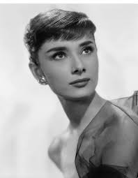 Often sorting out **Audrey Hepburn** from a random old photo where she  chats with others can give you a poster. This is how her unique beauty is.  This happened in this