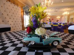 Diy wedding bouquet diy bouquet wedding flowers bridal bouquets rose bouquet floral bouquets flower boquet hand bouquet wedding colors. 1950 S Theme Flower Arrangement With Car O Brien Productions Located In Kennesaw Georgia Can Design Flower Arrangements For Your Company Picnic Theme Party Prom Homecoming Gala Or Holiday Party