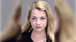 Authorities: Topless selfie causes woman to crash into parked police car