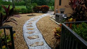 Rock Work Brown River Rock With Inset Pathway Of White Marble Chip Stone With Crab Orchard Flagstone Pathway Landscaping With Rocks Rock Garden Landscaping