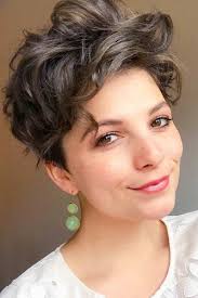 The top layers that are curled are swept over to one side to unbalance the style for a wild finish. Pixie Cut For Your Short Wavy Hairstyles Voluminou Hairs London