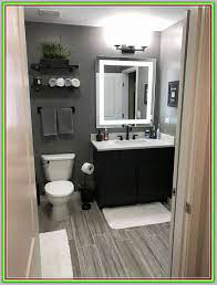 The significant addition comes with a plain color scheme helps to convey a very simple masculine feel. Dress Your Bathroom To Impress With These Modern Decor Tips Modern Interior Design Minimalist Small Bathrooms Grey Bathrooms Designs Small Bathroom