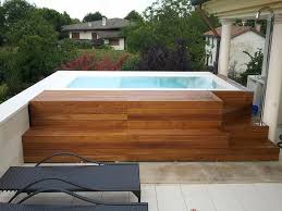 Concrete Outdoor Jacuzzi Hot Tub With Wooden Steps And Black Sunspots Amazing Jacuzzi Hot Tubs For Elegant Jacuzzi Hot Tub Jacuzzi Outdoor Hot Tub Landscaping