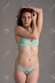 Pale Redhead Dressed In Teal Lingerie Stock Photo, Picture And Royalty Free  Image. Image 27896184.