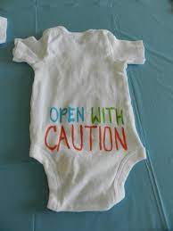 A Baby Shower Baby Shower Onesie Funny Baby Shower Games Baby Shower Funny