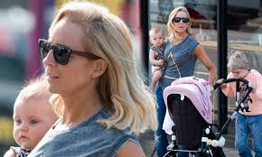 Carrie Bickmore cradles her baby daughter Evie in Melbourne