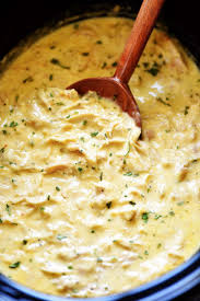 Discard thyme and bay leaf, then shred chicken with two forks. This Slow Cooker Creamy Italian Chicken Is Pure Comfort Food Chicken Crockpot Recipes Crockpot Dishes Recipes