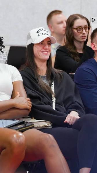 Even the biggest stars are locked in. 👀, Caitlin Clark enjoying the action  in Las Vegas at NBA Summer League.
