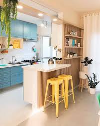 This scandinavian yellow kitchen plays up the bright theme with a modern yellow refrigerator and matching accent elements throughout the space. 24 Royal And Warm Blue Kitchen Design Ideas